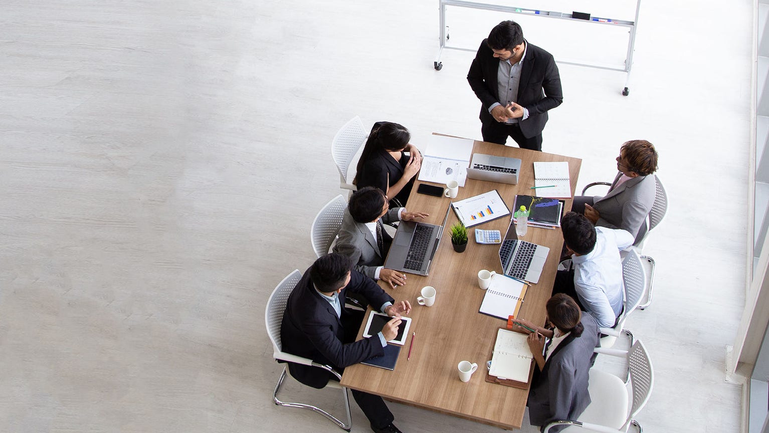 Group of co-workers collaborating at a table