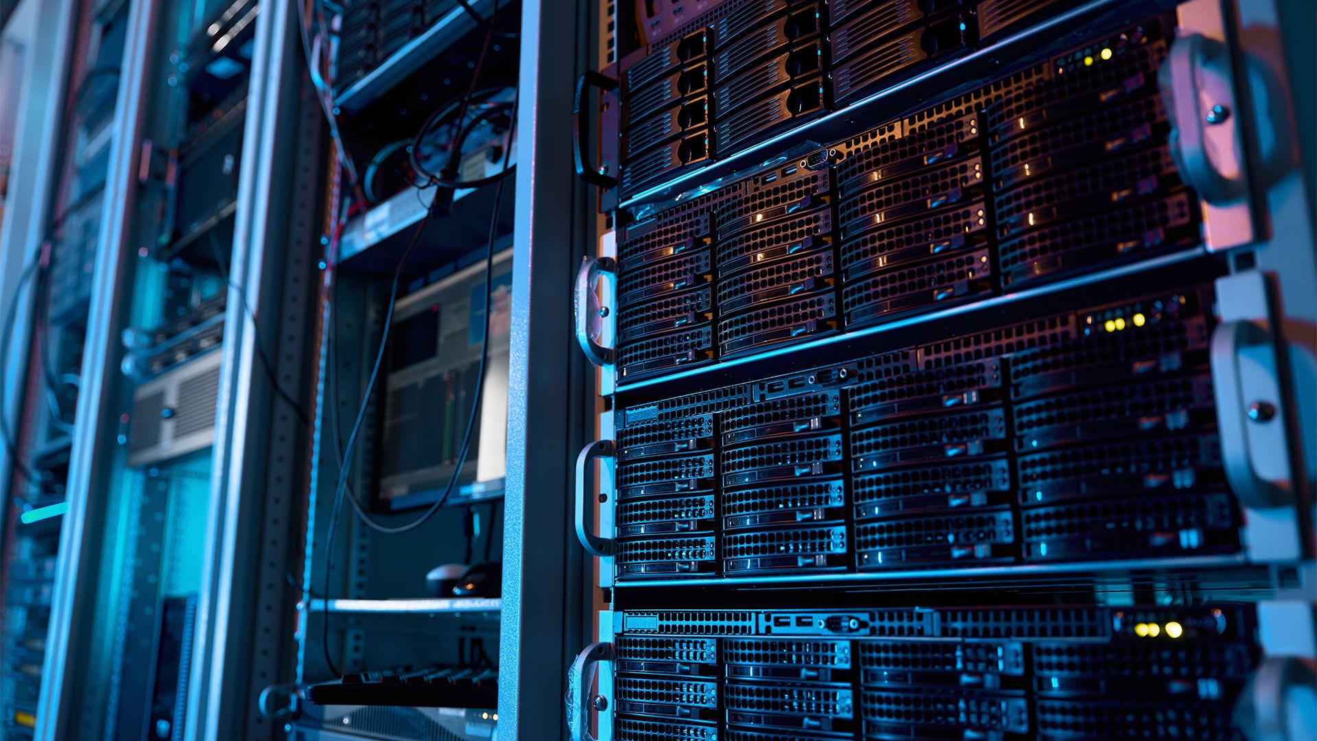 Server rack with supercomputer hardware and storage blades in big data center inside closeup. Datacentre interface and switch for digital communication and internet