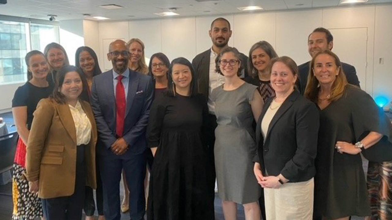Pritha Mittal (back row third from left) and Jessica George (back row, first from left) from the Macquarie Group Foundation with grant partners in the Americas. 