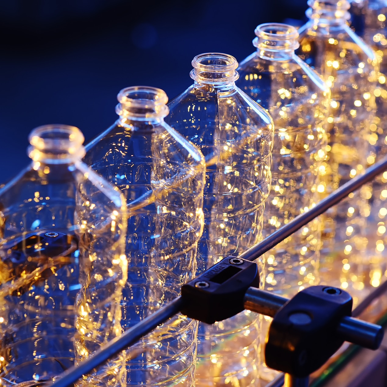 close up shot of plastic bottles on a conveyor belt 