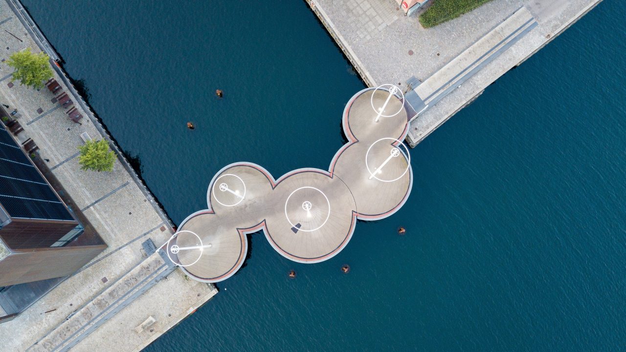 Copenhagen, Denmark - May 27, 2019: Aerial drone view of the modern Circle Bridge, a pedestrian bridge in the harbour area.
