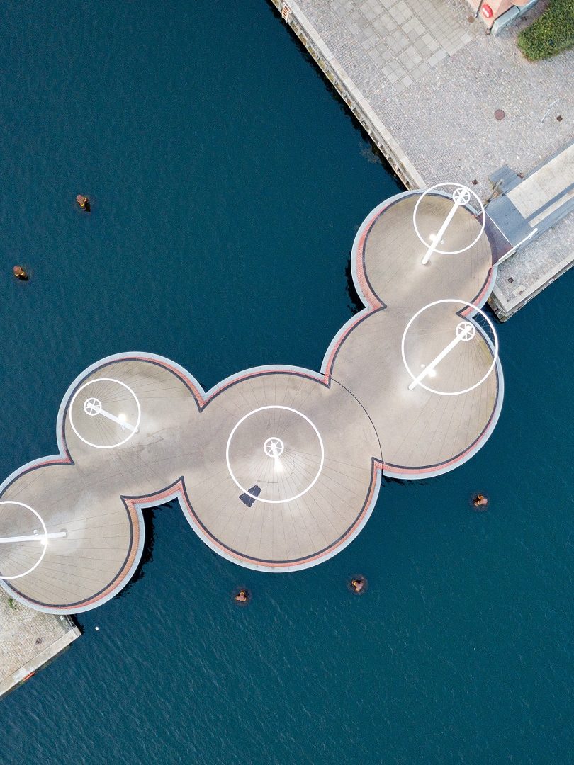 Copenhagen, Denmark - May 27, 2019: Aerial drone view of the modern Circle Bridge, a pedestrian bridge in the harbour area.