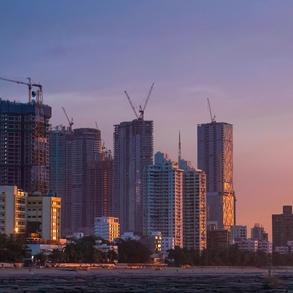 A Mumbai cityscape and construction cranes