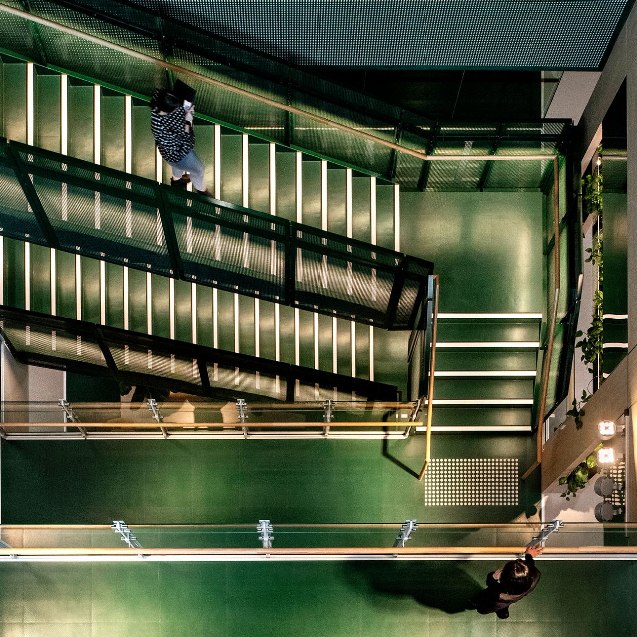 Overhead view of green stairs in new Macquarie office in Melbourne