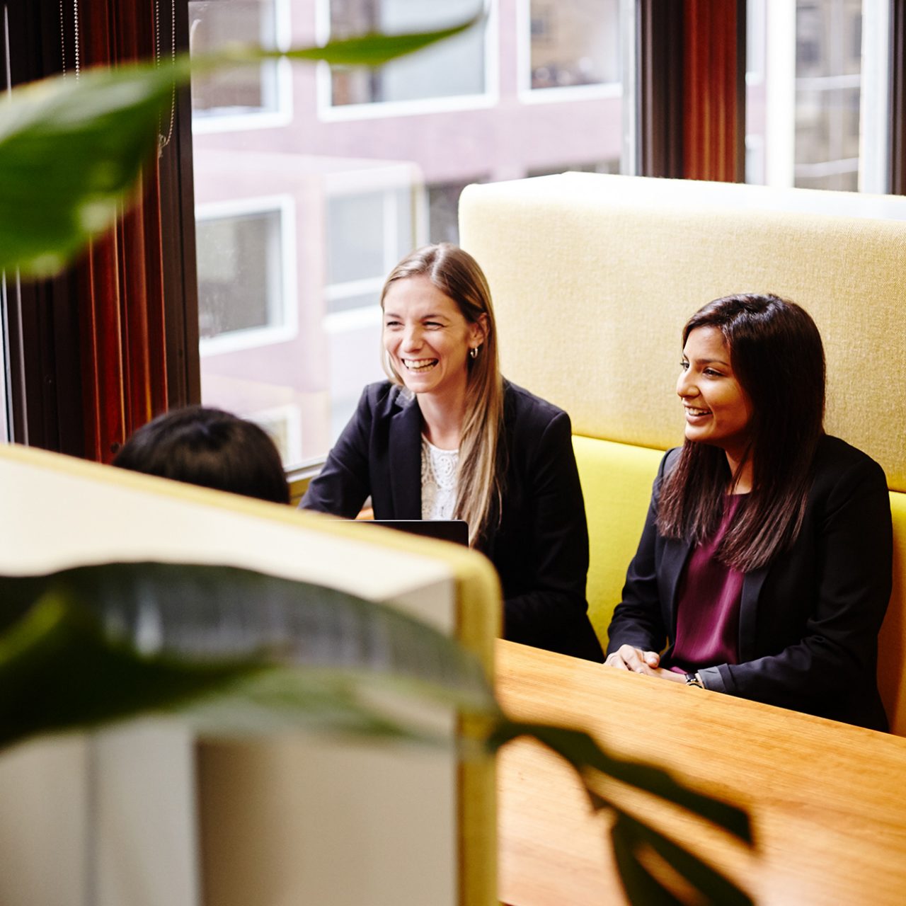 Team meeting in booth at Macquarie office, Sydney