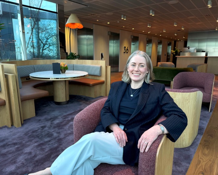 Kate Rudolph seated in a chair, smiling
