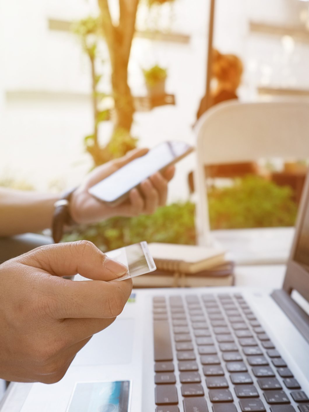 Man using credit card to purchase online goods