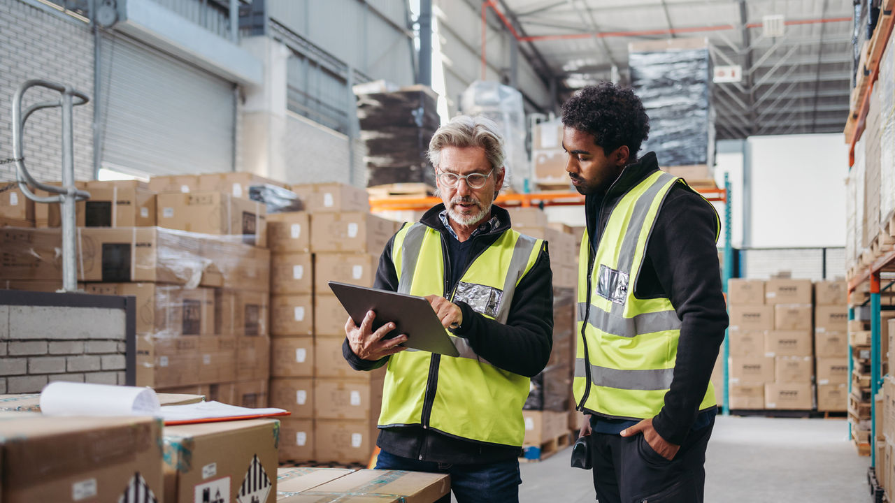 men looking at tablet image