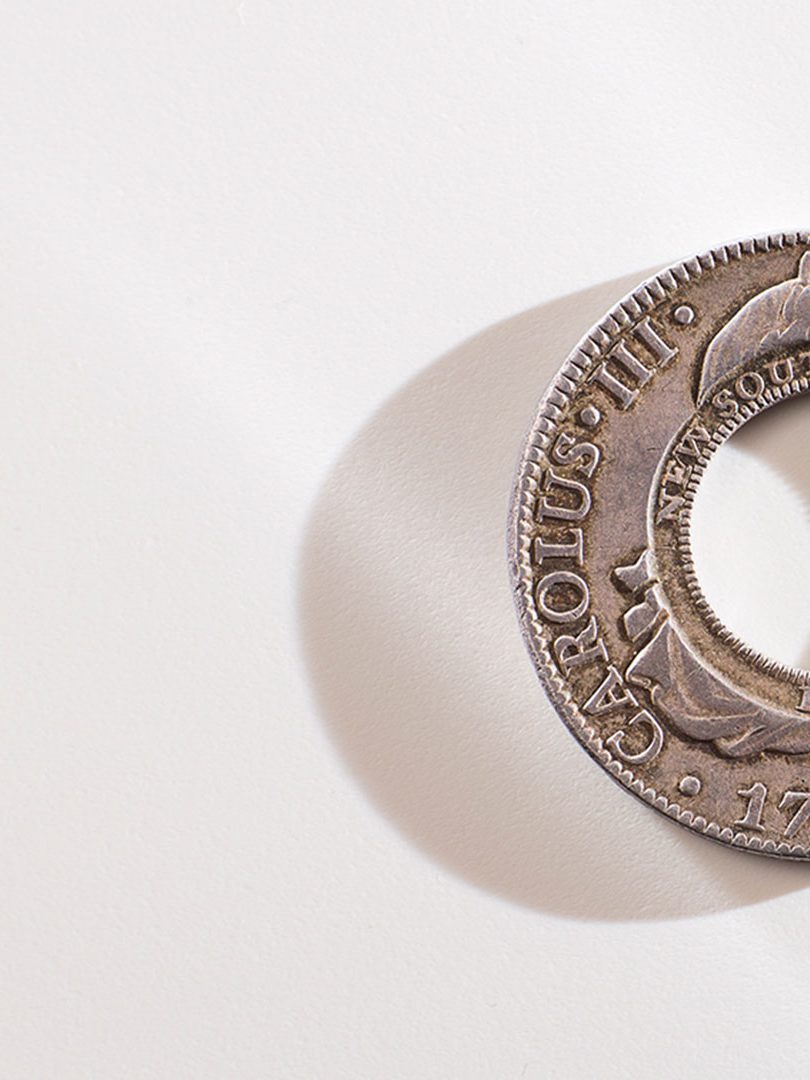 Macquarie Holey dollar on white background for general hero component