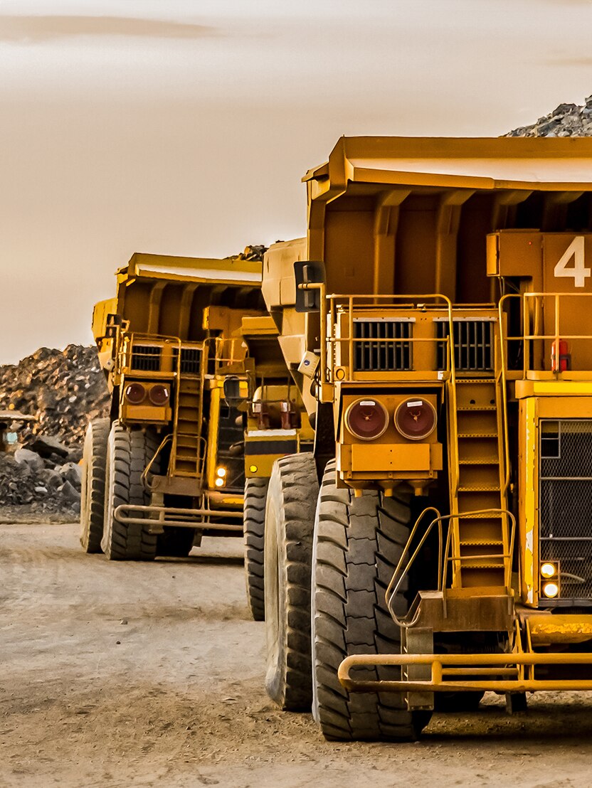 Dump Trucks transporting Platinum ore for processing