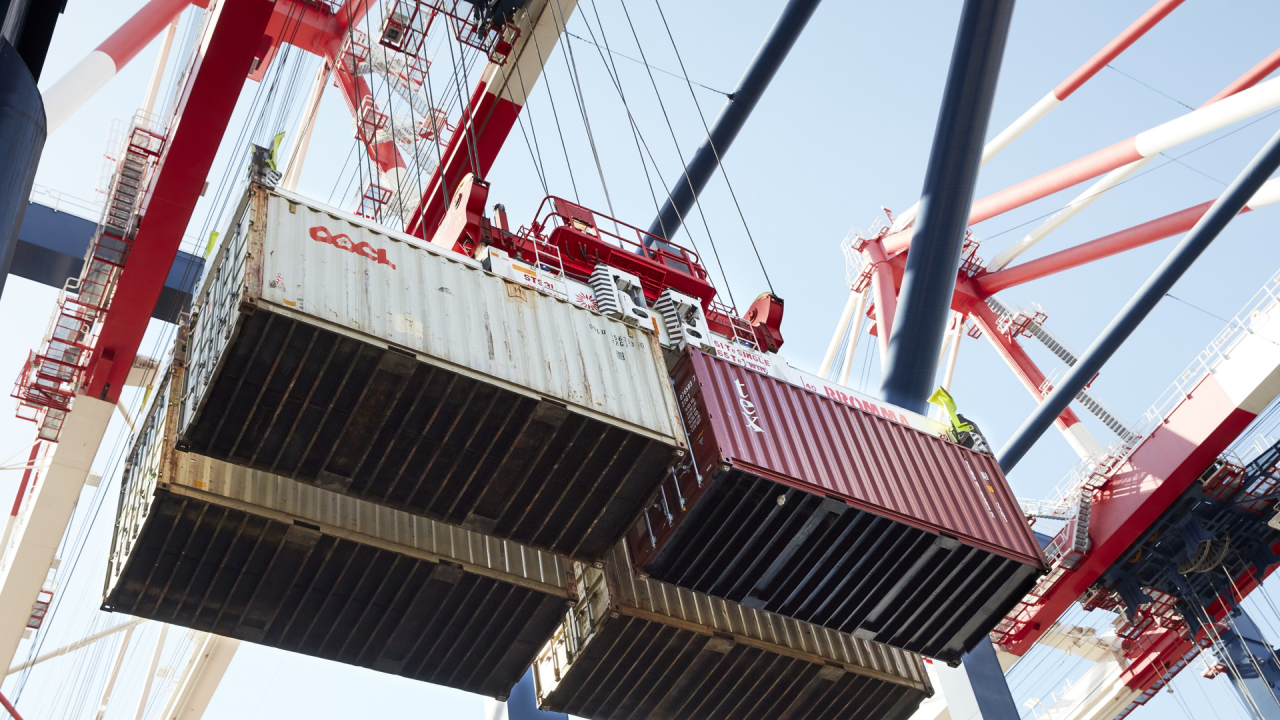 Cargo containers being lifted by crane