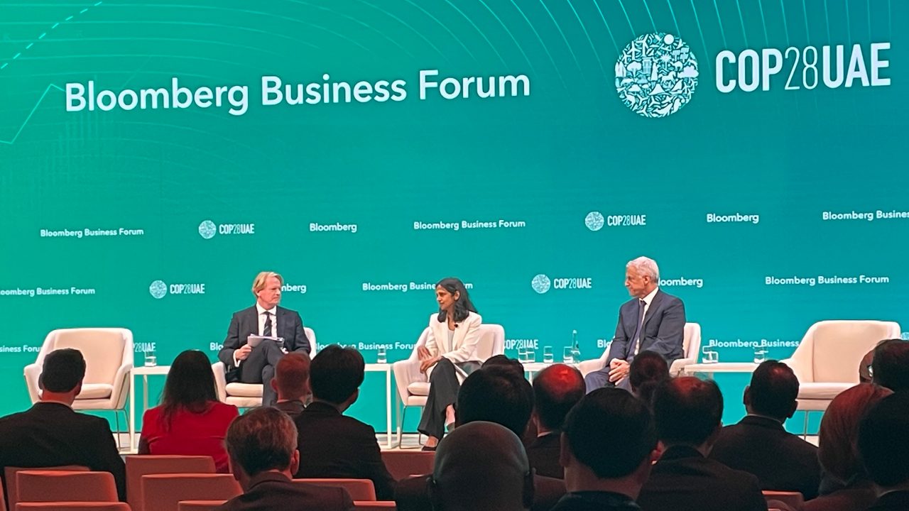 Shemara Wikramanayake speaks on a panel with Bill Winters, CEO of Standard Chartered (right), moderated by Jon Moore, CEO of BlombergNEF (left).