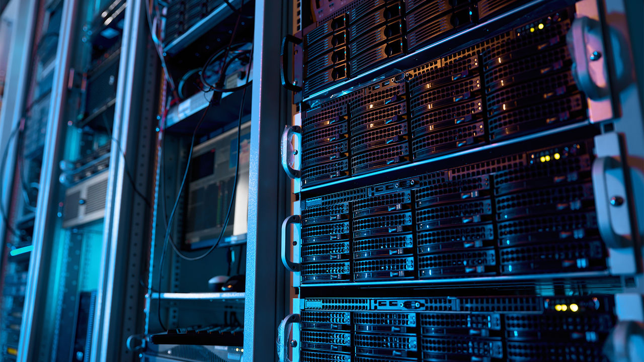 Server rack with supercomputer hardware and storage blades in big data center inside closeup. Datacentre interface and switch for digital communication and internet