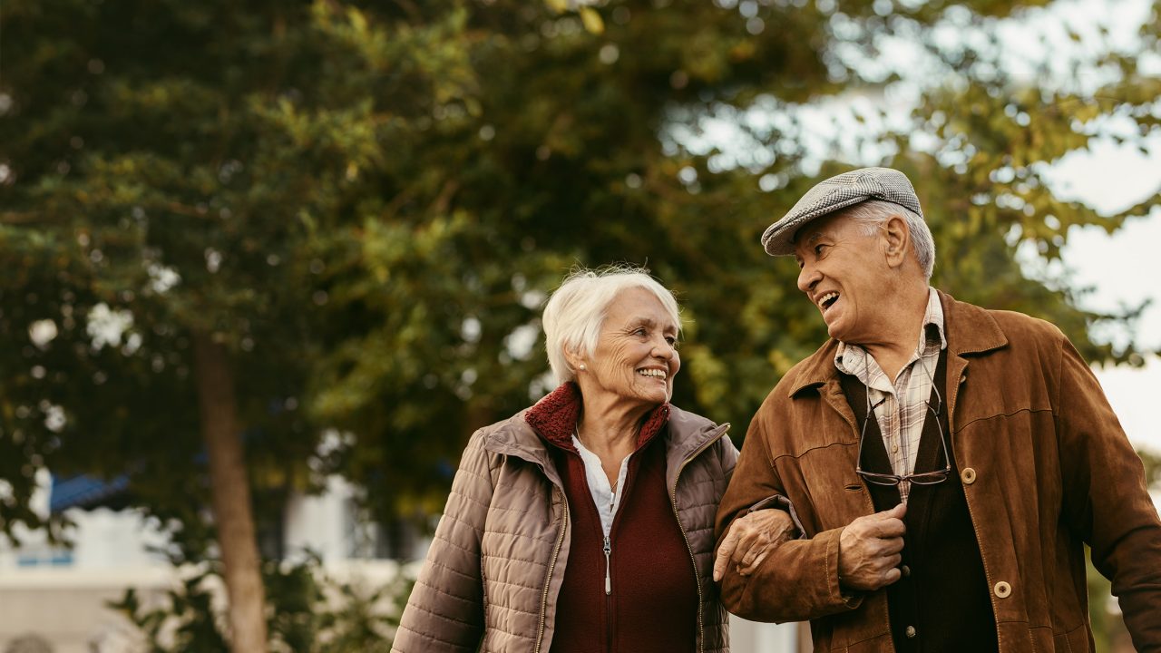 Senior couple enjoy a walk together on a winter day