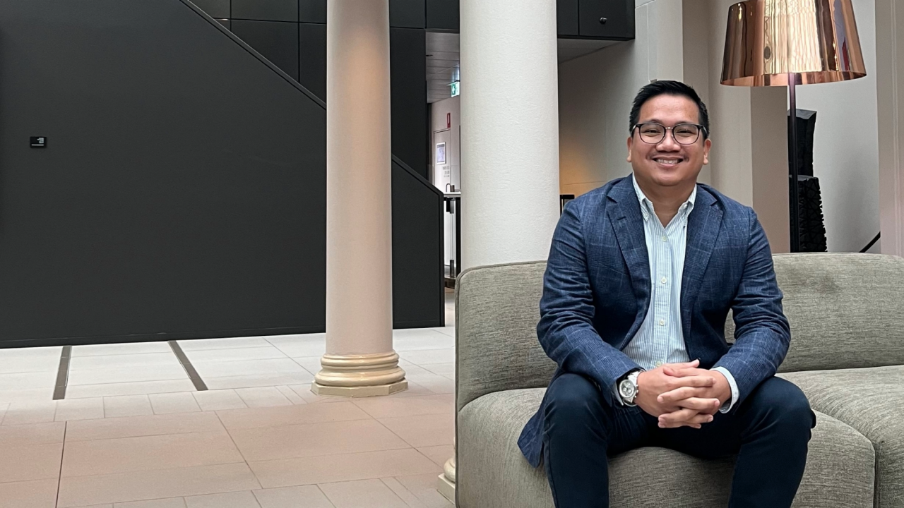 Jude Mazon in Sydney office, seated