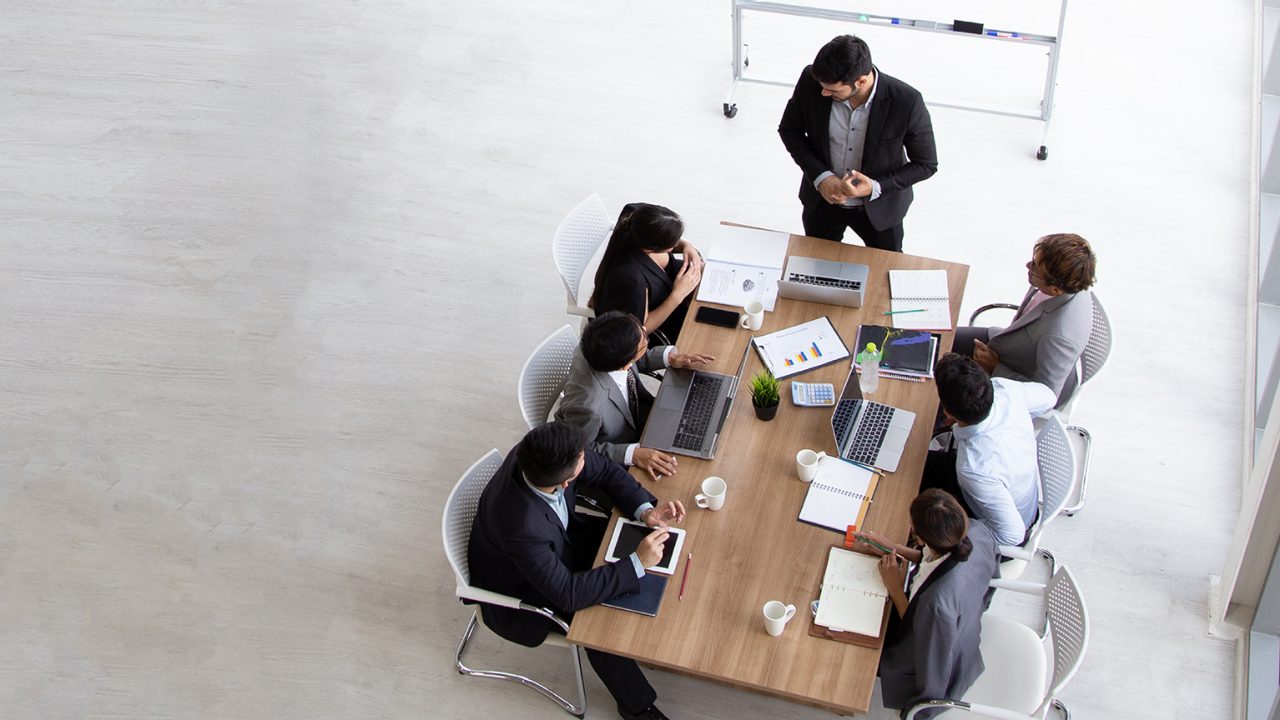 Group of co-workers collaborating at a table
