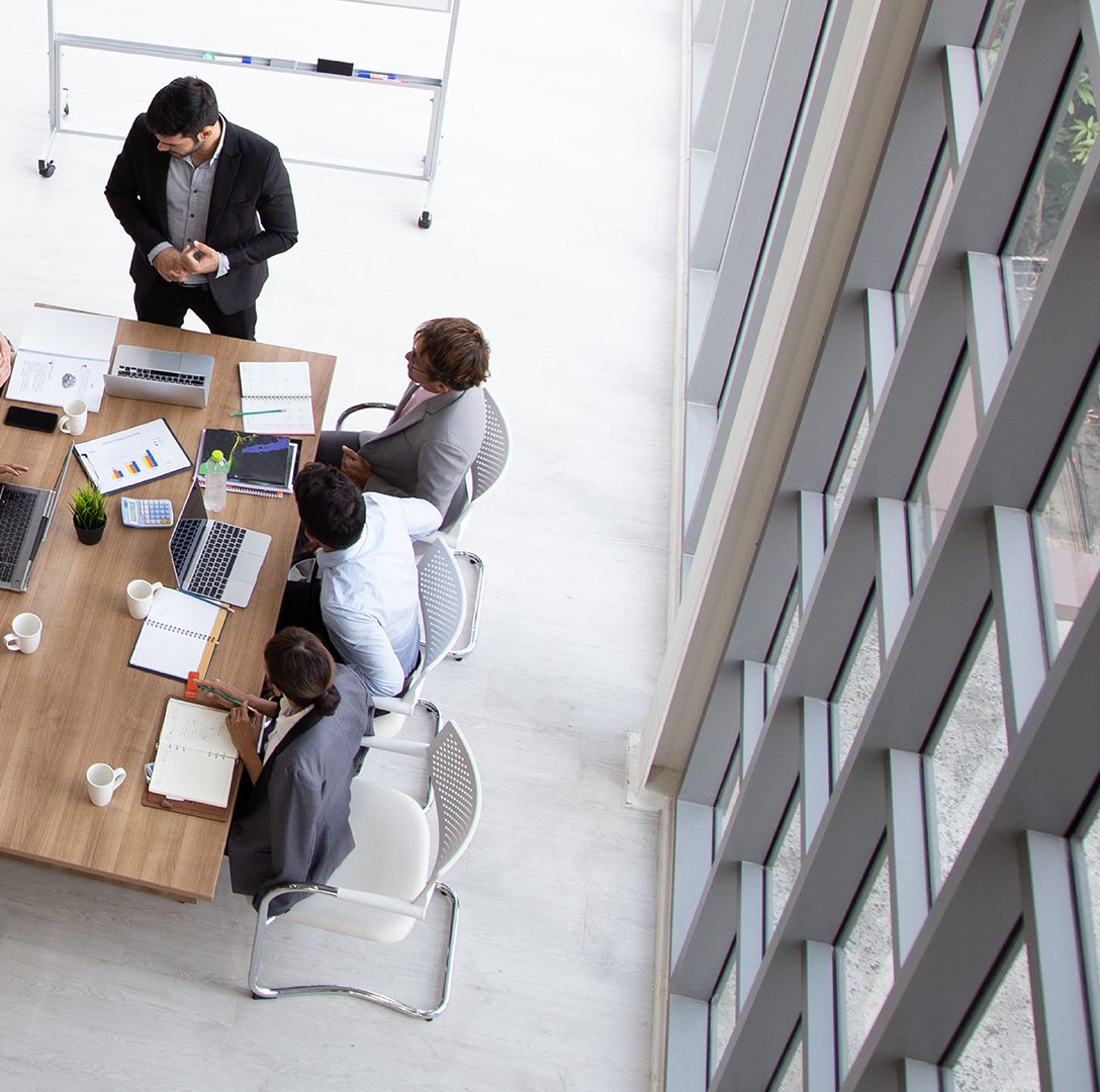 Group of co-workers collaborating at a table