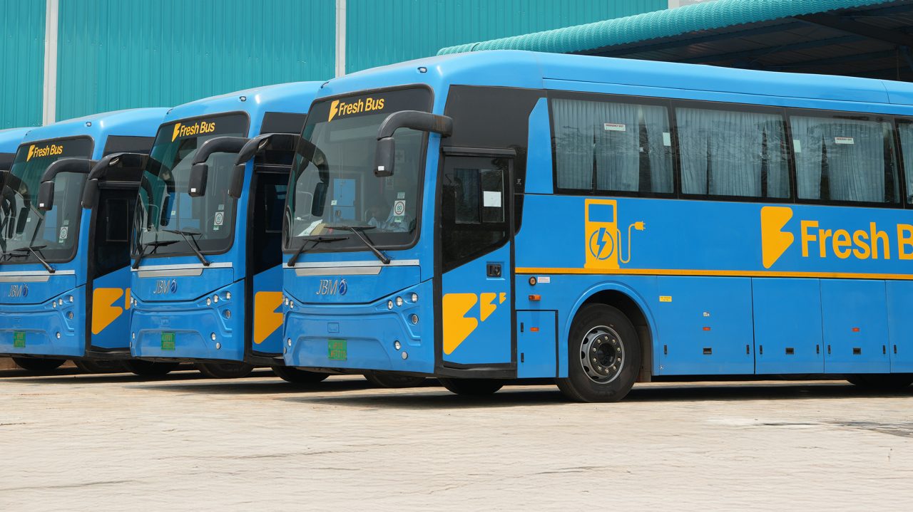 four buses parked in a row