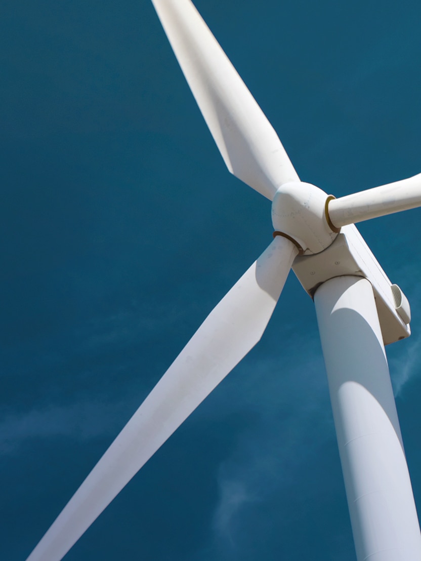 Windturbine against blue sky