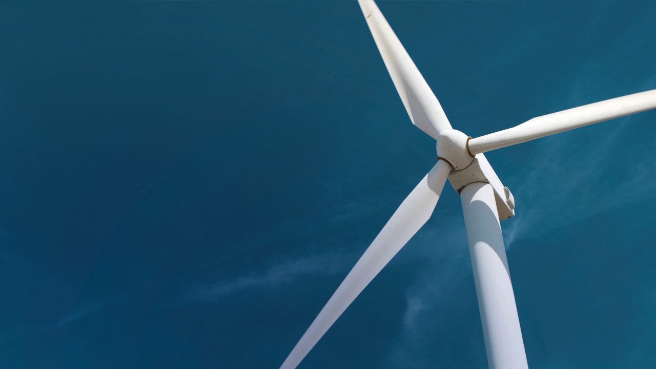 Windturbine against blue sky