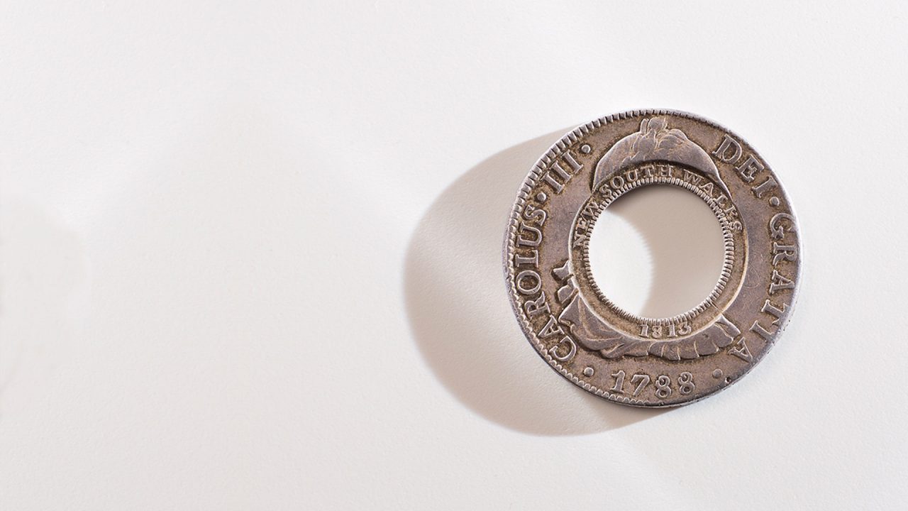 Macquarie Holey dollar on white background for general hero component