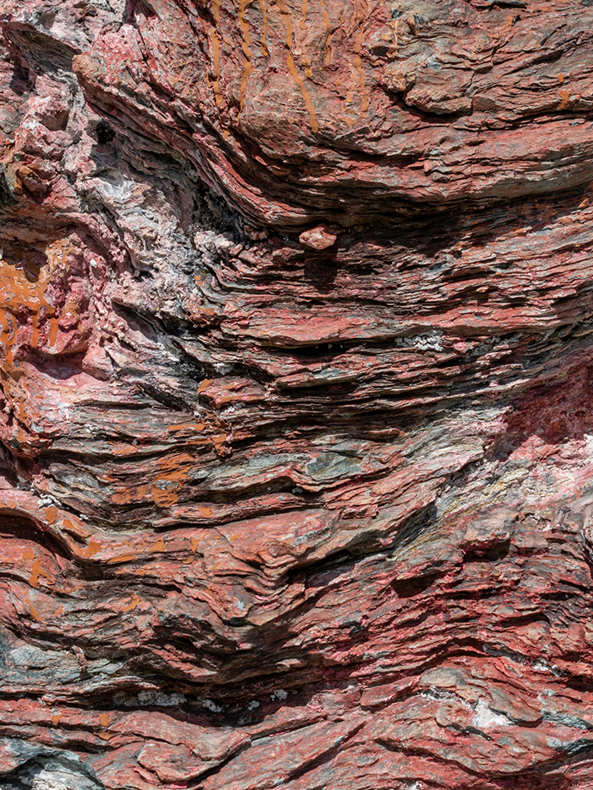 Rustic background in red color palette. Rustic background in the shape of a rock. Rustic background, similar to fire. giant red rock