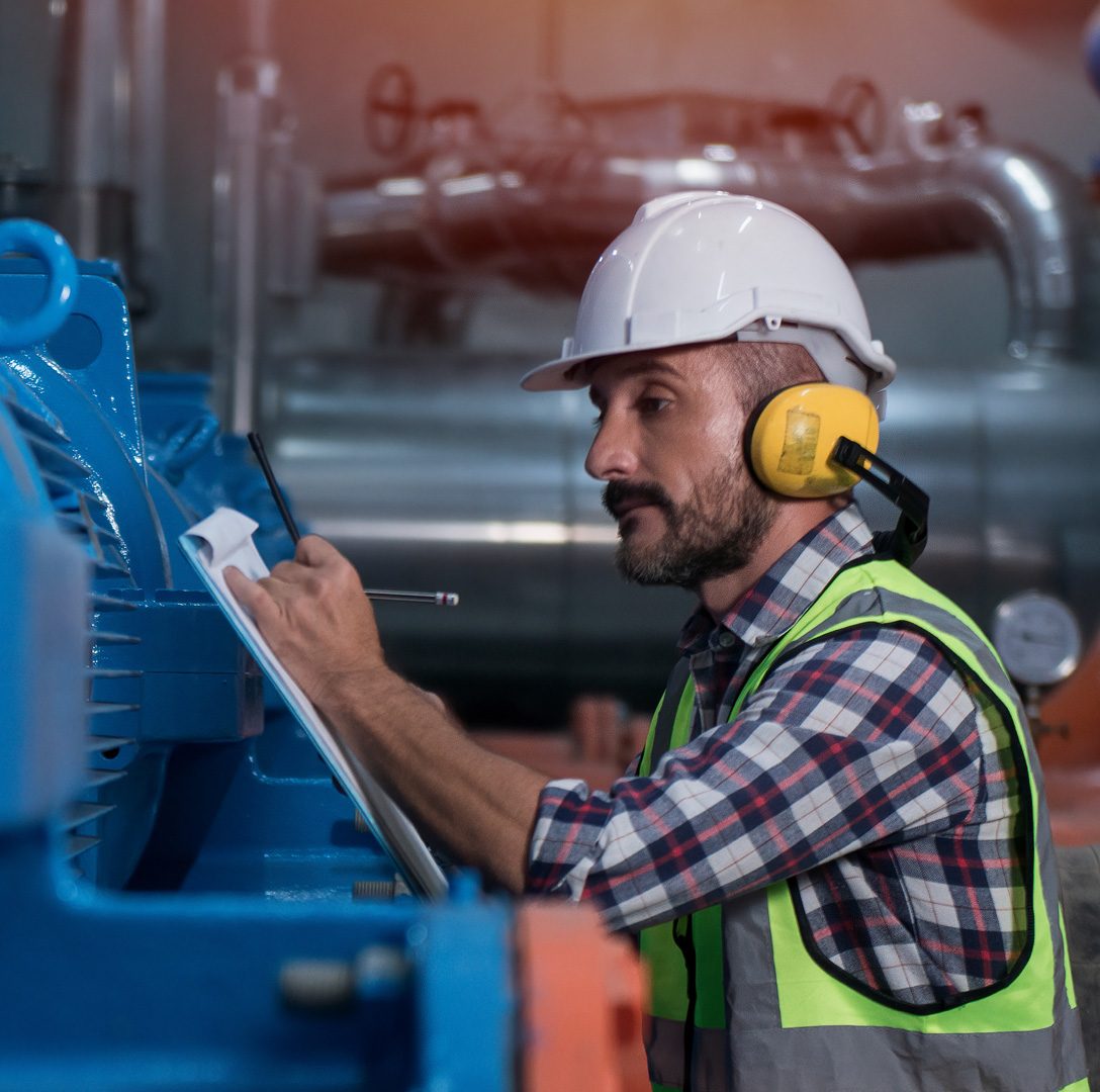 Industrial professional conducting a safety check on machinery