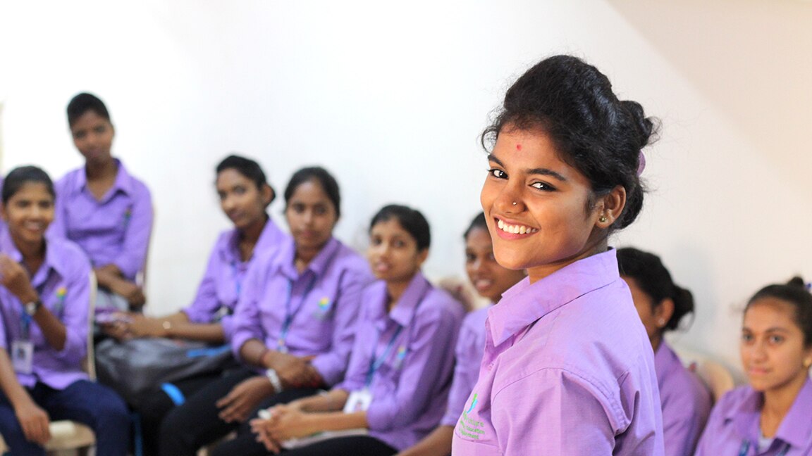 Student smiling at camera