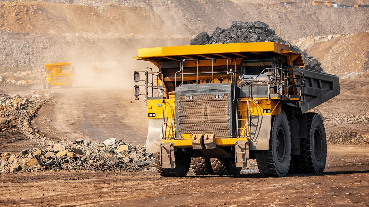 a yellow mining truck on a mining site