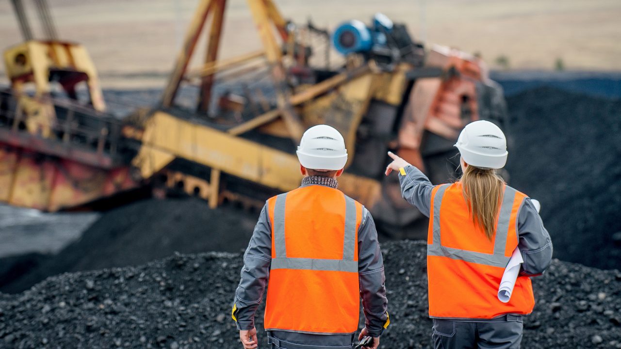 Coal mine workers in an open pit