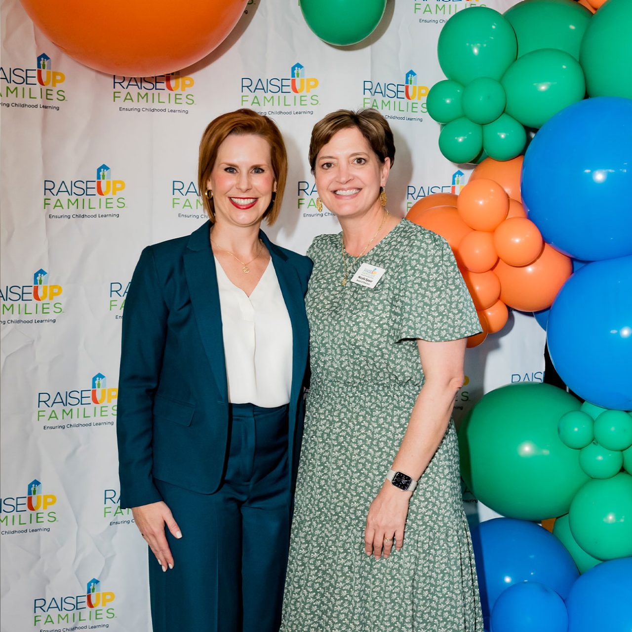 Angela Burgess, Executive Director of RaiseUp Families (left) with Nicole Spaur (right) at the Charity’s 2023 Graduation Celebration