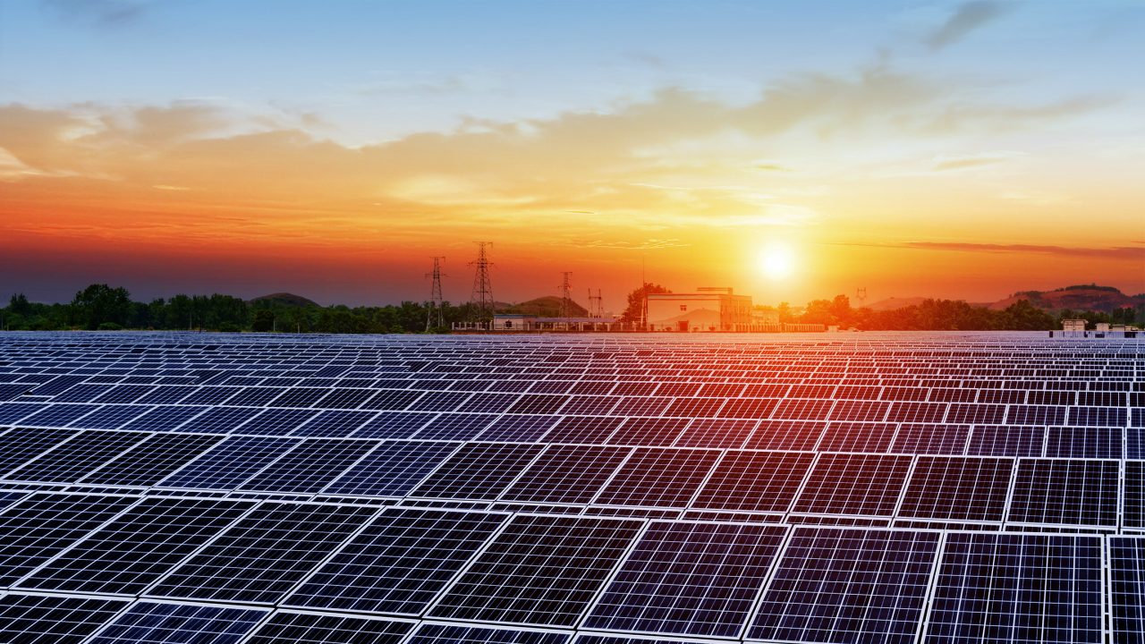 Solar panels under blue sky on sunset stock photo