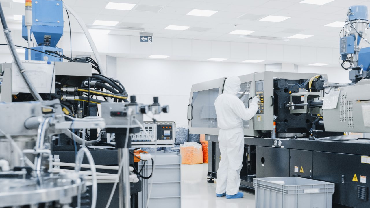 worker in clean suit semiconductor 